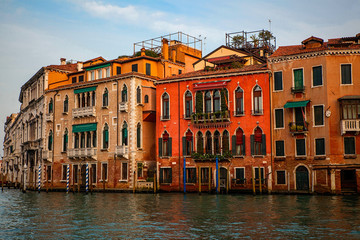 Fototapeta na wymiar Venice canal with boats and old architecture