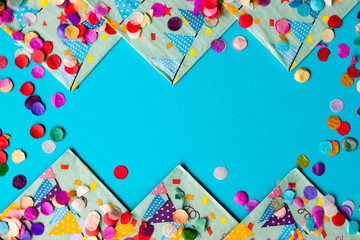 Fototapeta premium Colorful festive confetti Flat lay background frame Card for birthday Party, festival or carnival.