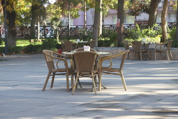 Fototapeta na wymiar table and chairs in cafe garden