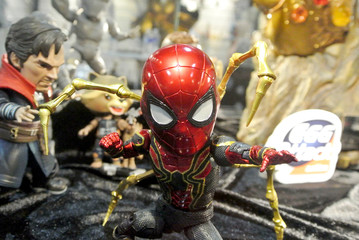 Fototapeta premium KUALA LUMPUR, MALAYSIA -APRIL 7, 2018: Selected focused of Marvel Comic action figure Spider-man with Iron Spider suit. He was one of the Avengers team. Action figures displayed by the collector. 