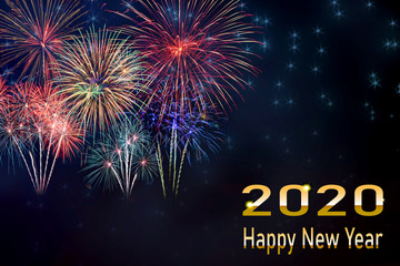 Amazing beautiful colorful fireworks display on celebration night happy new year 2020, showing on the  dark sky.