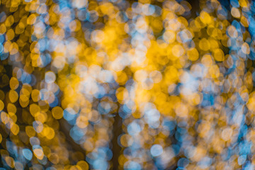 De focused/blur image of city at night.Bokeh lighting of the Christmas tree.light in the night.