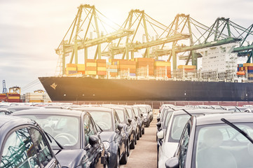 Harbor enviroment: Cars waiting to be loaded in freighter. Transportation industry and shipment...
