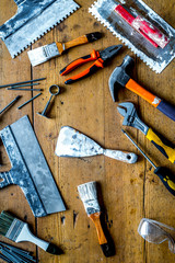 instruments set for decorating and building renovation on wooden background top view