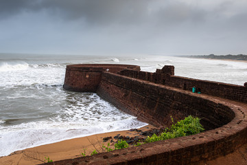 Old ruins of Fort Aguada on the seashores of Goa with sky and clouds
