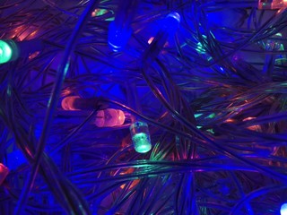 Colorful garlands Close up. Christmas card. Xmas holiday pattern. Happy anniversary wallpaper. Christmas greeting card. Decorative color art.