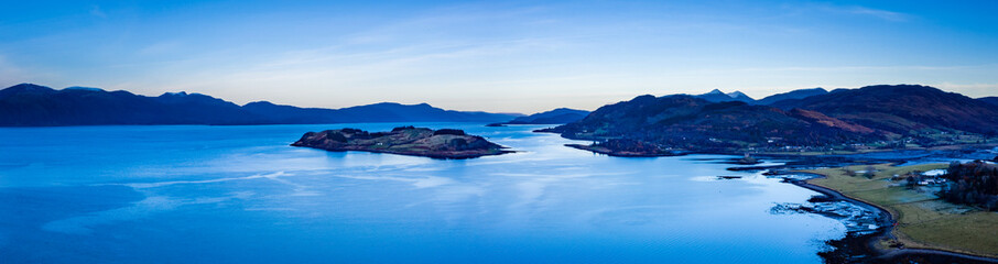 aerial panorama of loch linnhe on the west coast of scotland in the argyll region of the highlands near port appin and oban and fort william showing pink skies and calm blue water