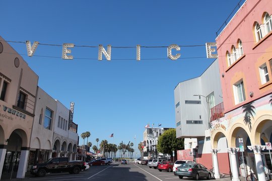 VENICE, UNITED STATES - APRIL 6, 2014: People visit Venice Beach, California. Venice Beach is one of most popular beaches of LA County. 9.8 million people live in LA County.