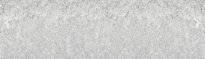 Light grey shabby concrete wall wide texture. Rough weathered cement surface long white backdrop....
