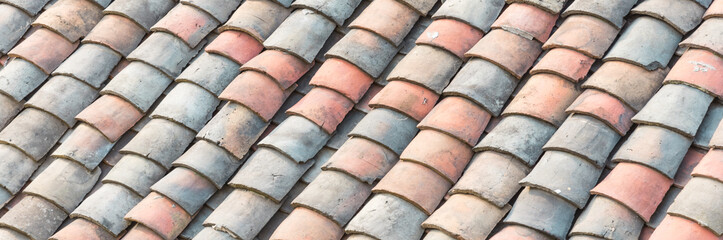 Panoramic colorful curved clay tiled roof from ancient house in the North Vietnam