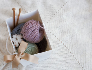 beautiful threads and crochet hooks on a wooden table.