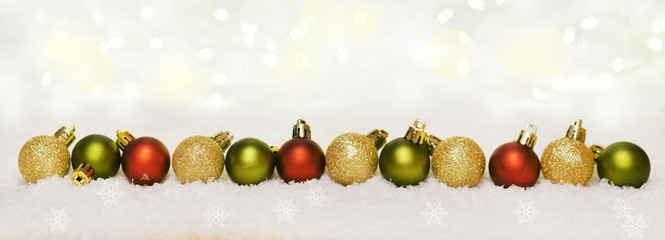 Christmas themed banner with Christmas baubles and snow