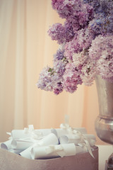 Lilac bouquet in a silver vase