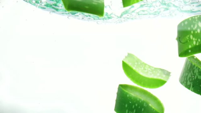 Fresh aloe vera drop on water slow motion.