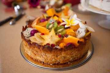 Cake with fresh fruits kiwi dragon fruit papaya mandarin carambola