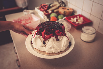 Pavlova cake with fruit cream