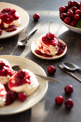 Homemade mini pavlova cake with cherries