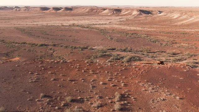 Aerial: Footage of Coober Pedy Breakaways. Tourism South Australia. Outback roadtrip.