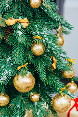 Christmas background. Green fir tree with golden balls. - 303903761
