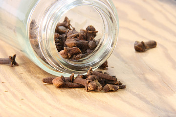 Seasoning cloves in a glass jar