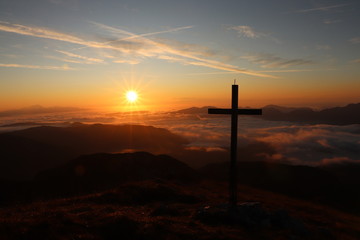 Cross next to morning sun, mountain Ogradi, Bohinj