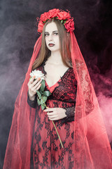 witch vampire girl in red dress with red veil - 303910710