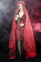 witch vampire girl in red dress with red veil - 303910756