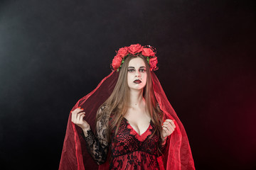witch vampire girl in red dress with red veil - 303910917