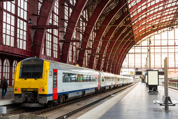 Fototapeta na wymiar Train on railway station, travel in Europe