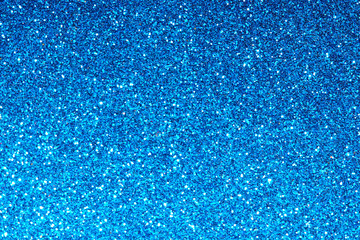 blue Sparkling Lights Festive background with texture. Abstract Christmas twinkled bright bokeh...