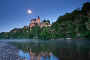 Fototapeta na wymiar Chateau Monfort at sunrise and moonlight, France, Dordogne