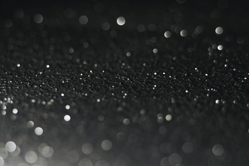 Silver Sparkling Lights Festive background with texture. Abstract Christmas twinkled bright bokeh defocused and Falling stars. Winter Card or invitation	