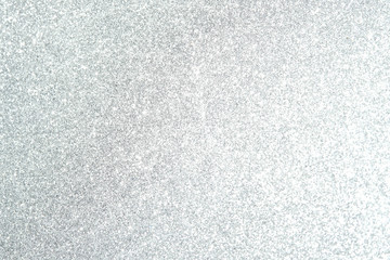 Silver Sparkling Lights Festive background with texture. Abstract Christmas twinkled bright bokeh defocused and Falling stars. Winter Card or invitation	