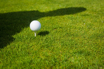 Close up of golf ball on tee with copy space