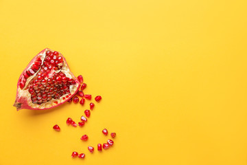 Ripe juicy pomegranate on color background
