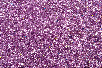 purple Sparkling Lights Festive background with texture. Abstract Christmas twinkled bright bokeh defocused and Falling stars. Winter Card or invitation	