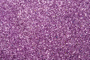 purple Sparkling Lights Festive background with texture. Abstract Christmas twinkled bright bokeh defocused and Falling stars. Winter Card or invitation	