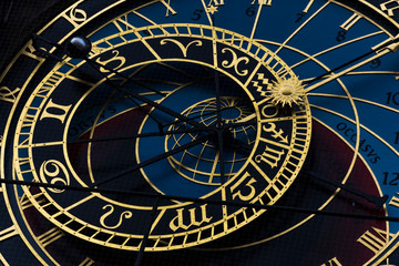 Naklejka premium The dominant of Prague astronomical clock on old town times square. Gold wheels shows period, moon phase and next signs.