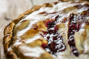 Berry pie with blueberries close-up on a plate on the table. horizontal
