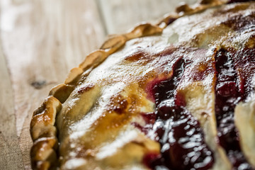 Berry pie with blueberries close-up on a plate on the table. horizontal