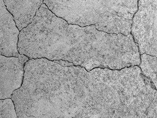 Abstract cement background. Cracked concrete texture closeup.