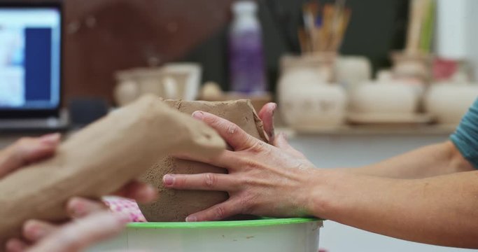 Woman girl her hands dub wall jug, sculpts out of clay on circle, top view.Online tv show and Hand made visual idies. Freelance lifesyle and new expiriens for explore. New oroginale hobby
