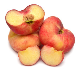 Peach saturn fruit whole and half isolated on white background. Flat lay, top view