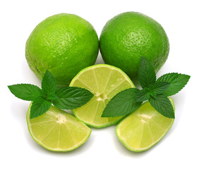 Lime fruit whole, half and slices with mint isolated on a white background. Creative juice concept. Flat lay, top view