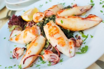 Macro Close up of grilled calamari and green asparagus