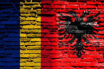Flag of Albania and Chad on brick wall