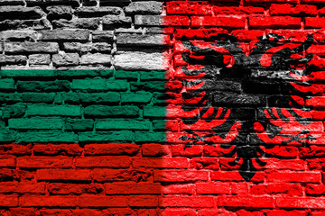 Flag of Albania and Bulgaria on brick wall