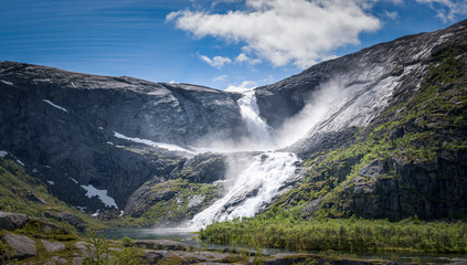 Fototapeta na wymiar Sotefossen waterfall raging down in Husedalen mountain valley Norway panorama