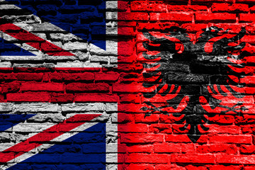 Flag of Albania and England on brick wall
