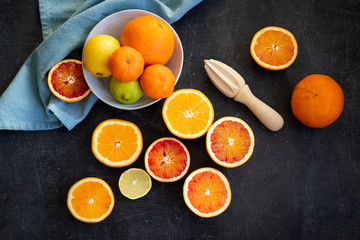 Colorful slices of various citruses such as orange, lemon, lime or blood orange
